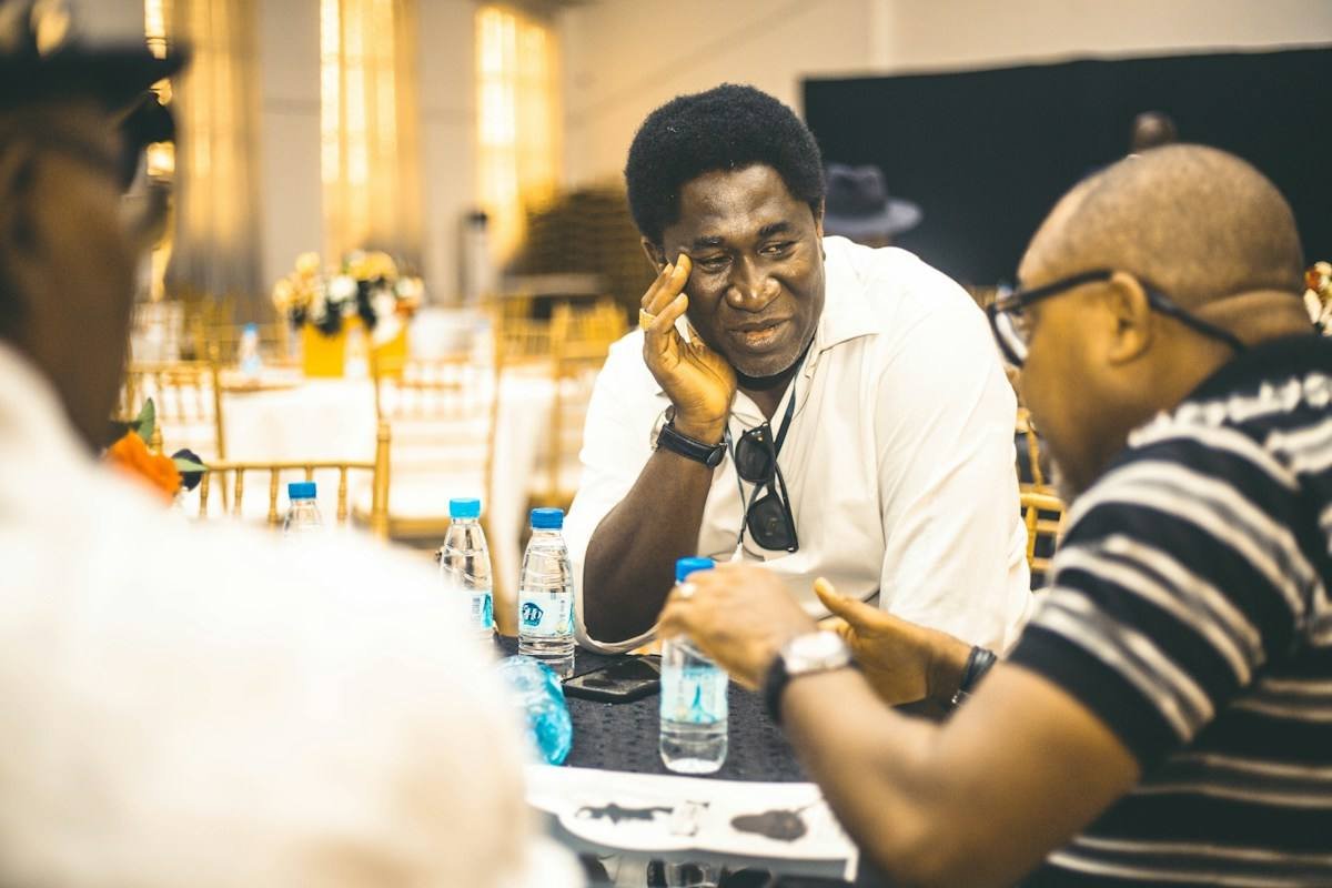 A coaching conversation between two men in Nigeria