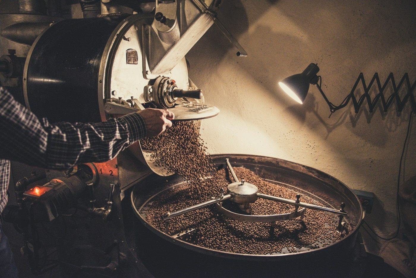 A coffee roaster at work — raw beans transformed in place