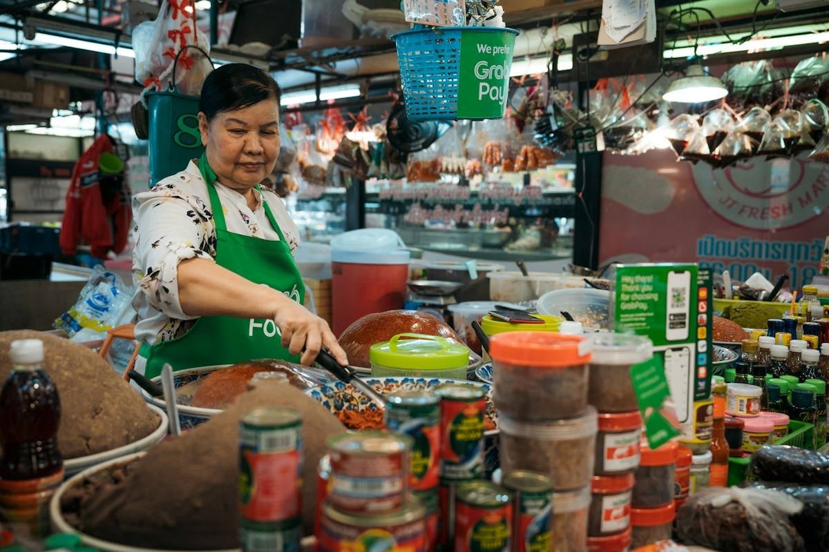 A cook preparing food in a small kitchen in the Philippines
