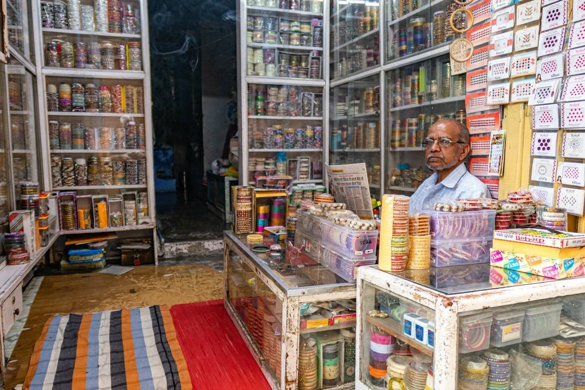 A shopkeeper in his shop in Udaipur, India