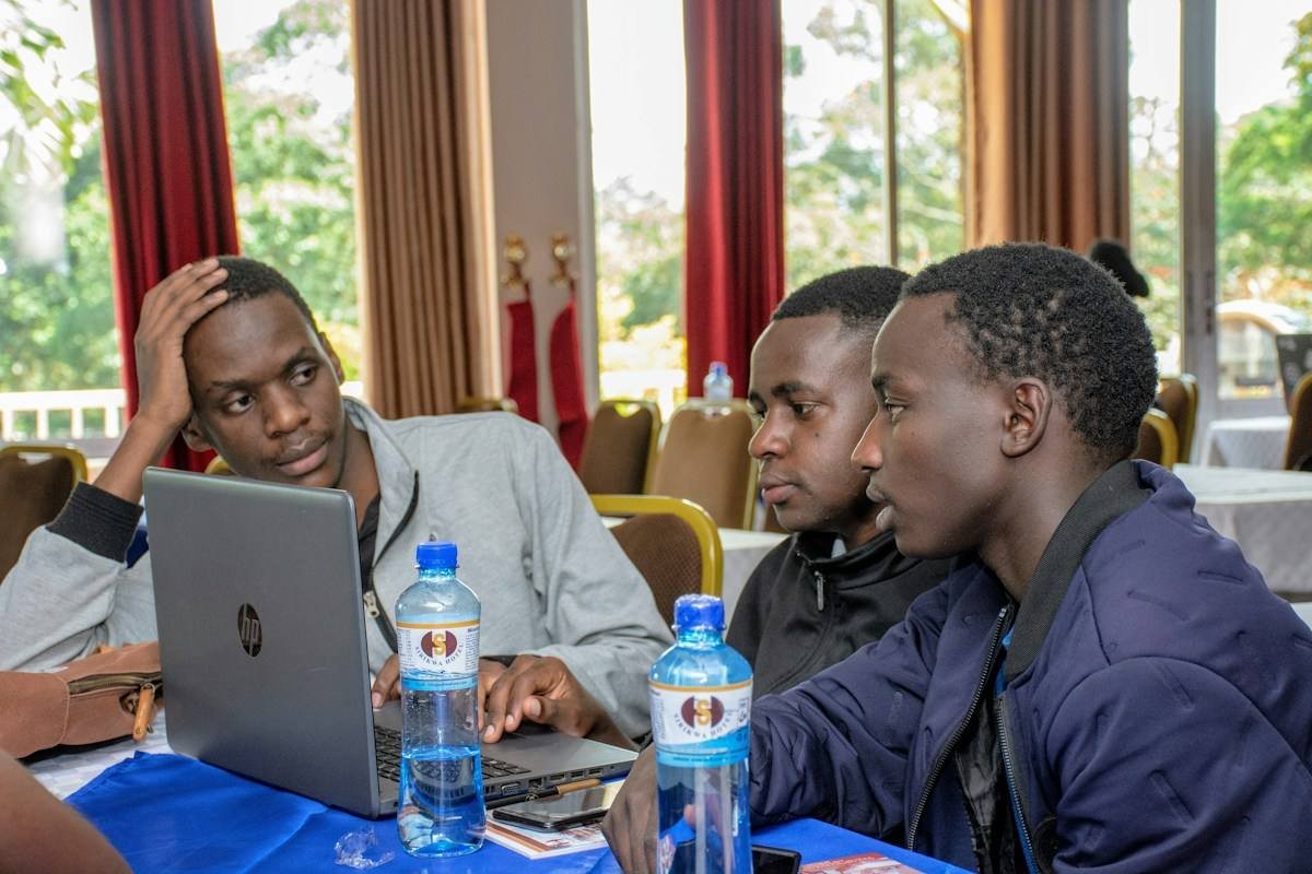 Young professionals working on laptops in Kenya