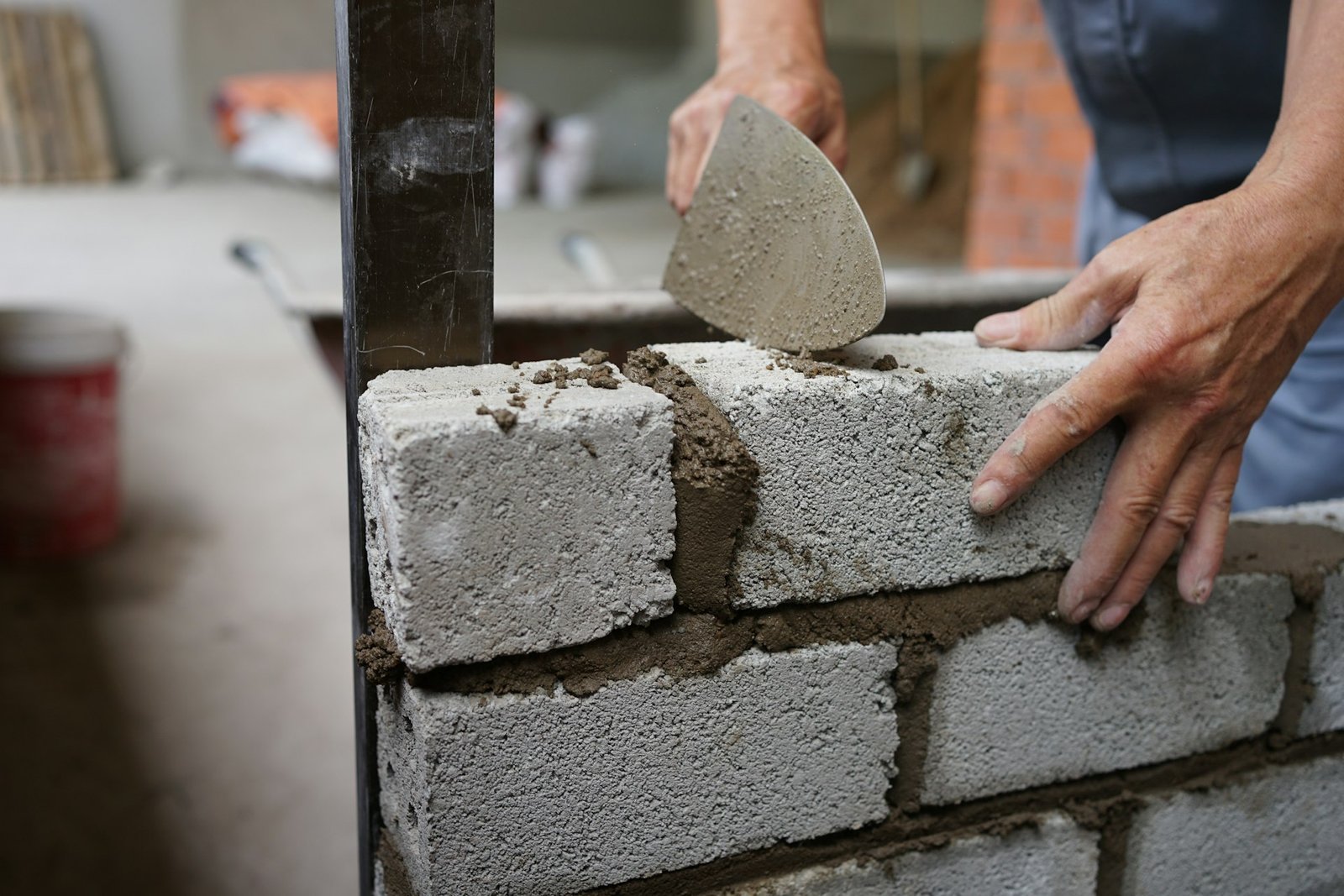 A mason laying a block wall