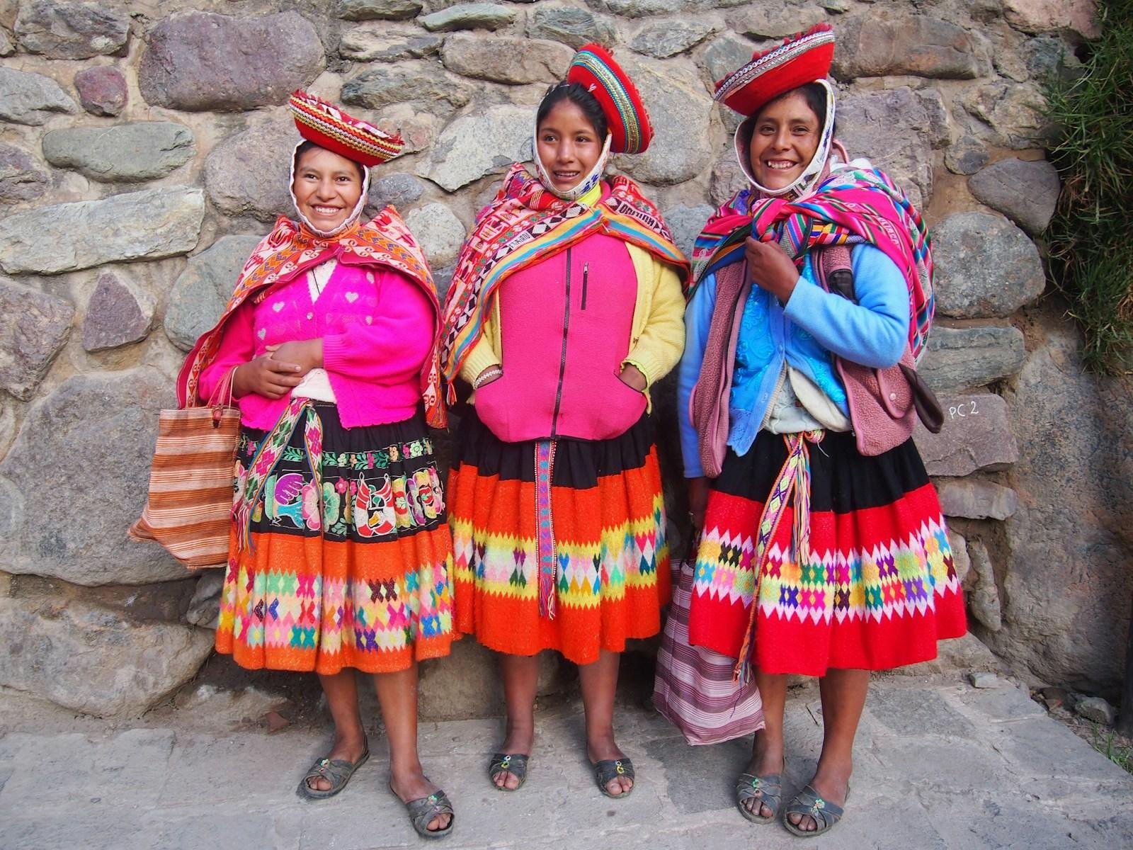 Three women in traditional dress in Peru