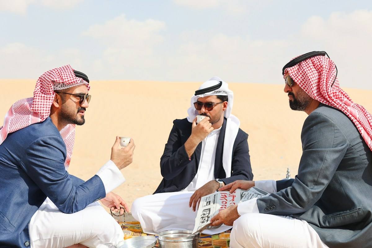 Men sharing tea in the Gulf